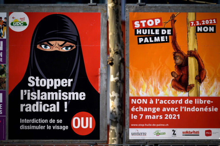 Switzerland votes to ban face coverings including burka and niqab in controversial referendum