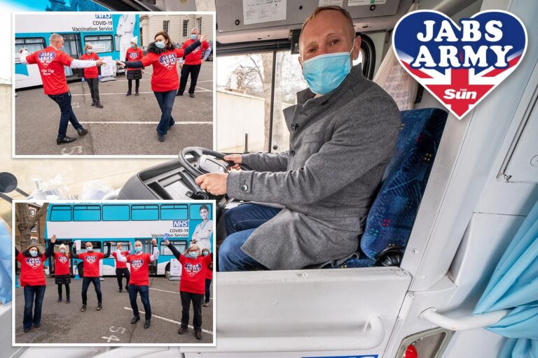 Judge Rinder poses for selfies with Jabs Army volunteers as he visits vaccine bus