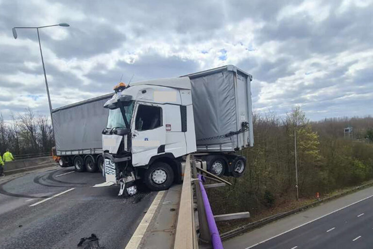 M25 and A2 travel chaos as lorry hangs off 80ft bridge after smashing through barrier to spark huge…