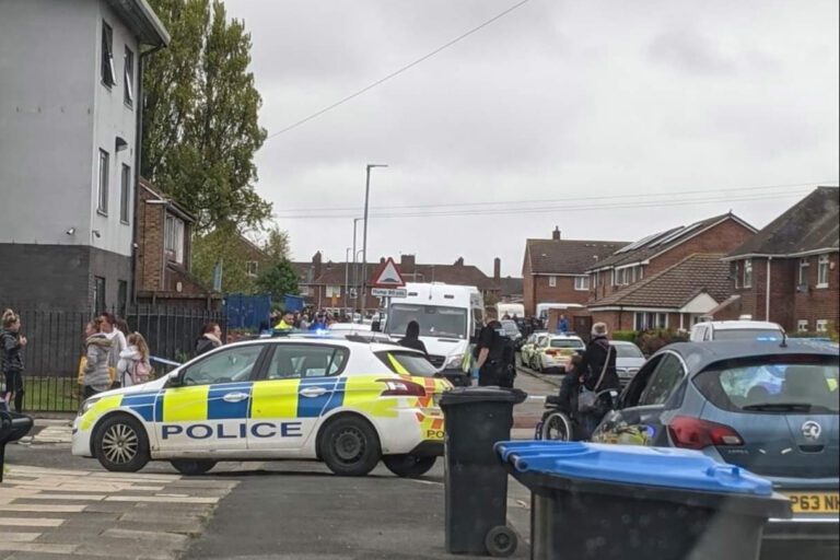 Armed cops swoop on school as four men ‘fight with weapons’ in front of terrified kids