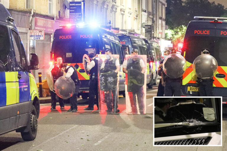 Armed police and officers in riot gear pelted with missiles by mob after being called to man shot…