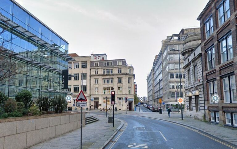 Woman, 18, dies after falling from city centre building as man, 21, arrested on suspicion of murder