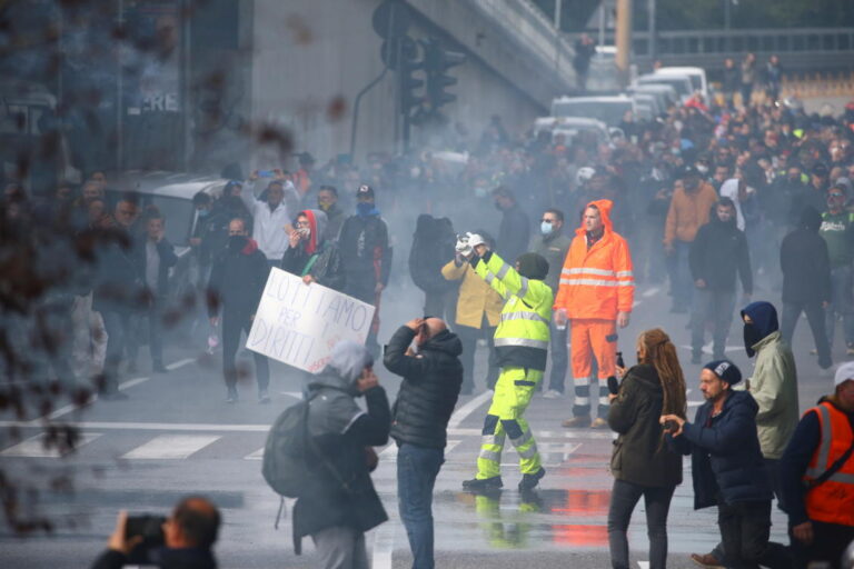 Italian police use water cannon on port protesters