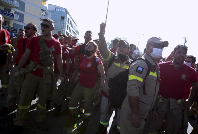 Greek firefighters clash with police at climate ministry