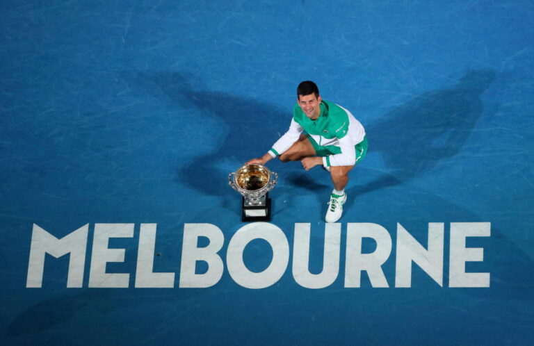 Tennis-Djokovic lands amid vaccine storm but held up by visa issue