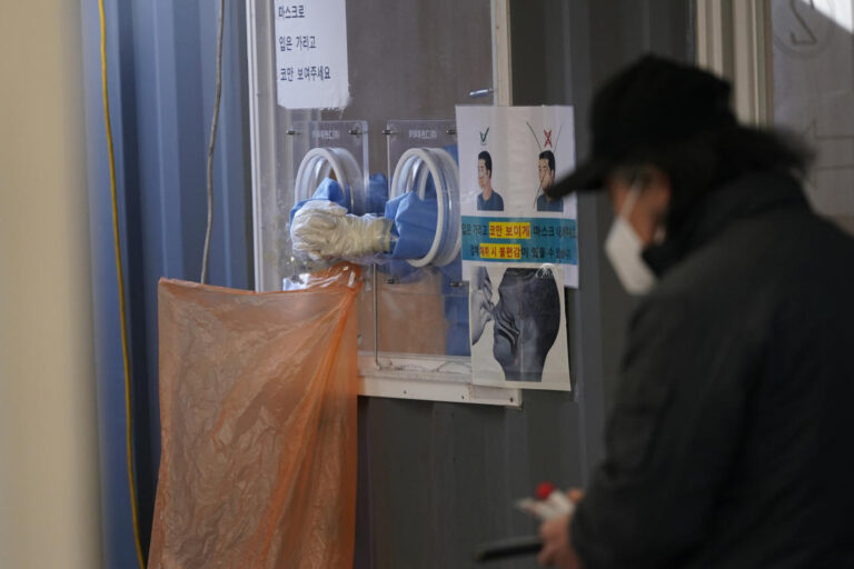 South Korea slightly eases distancing but warns of omicron surge