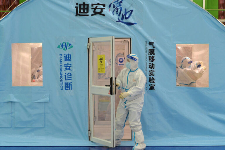 Chinese cities on high COVID-19 alert as Lunar New Year travel season starts; omicron spreads