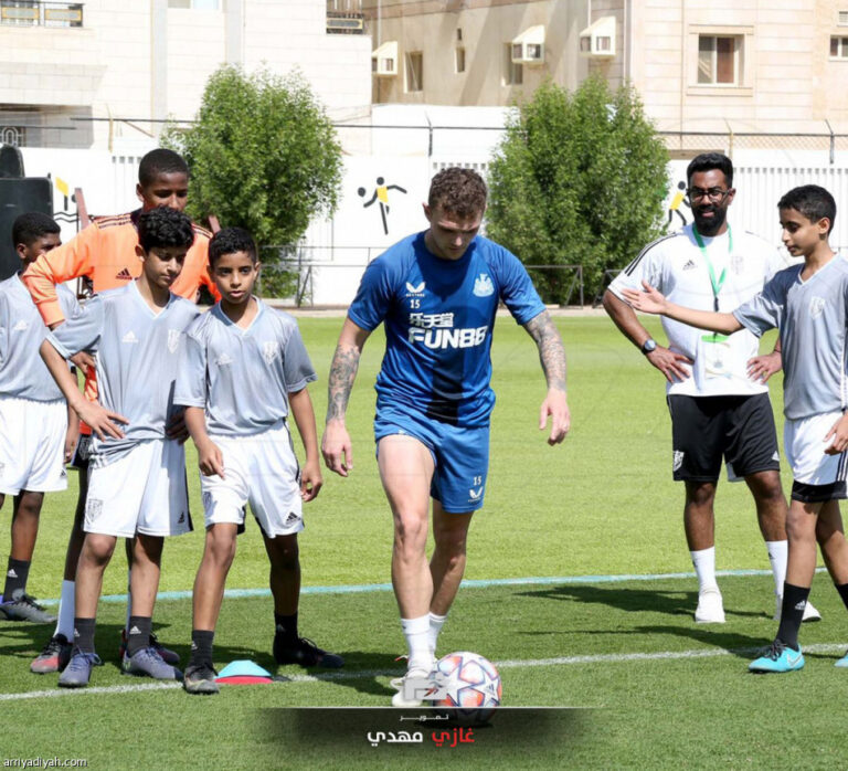 Newcastle players take part in training session with youngsters from Saudi Mahd Academy