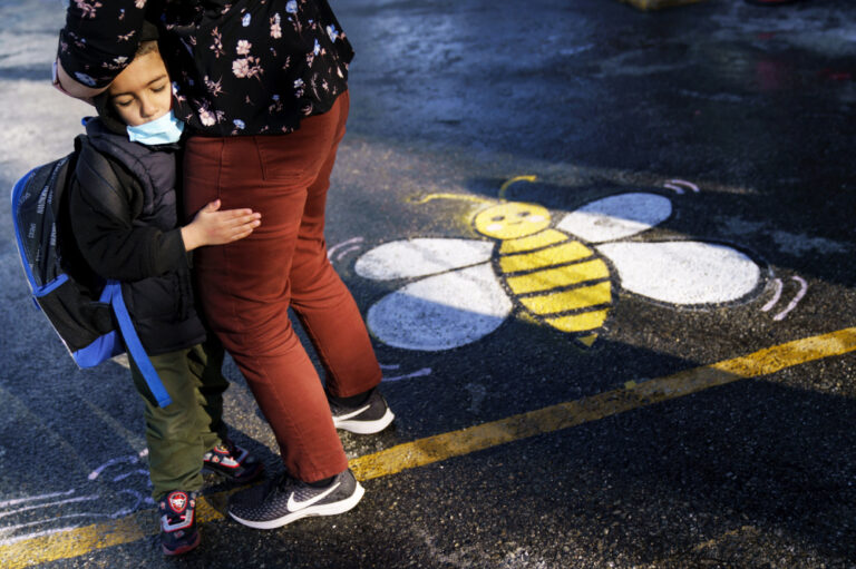 Under pressure to ease up, Biden weighs new virus response