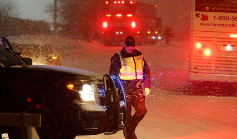 Canadian police arrest leaders of defiant truckers as disruptive protests continue