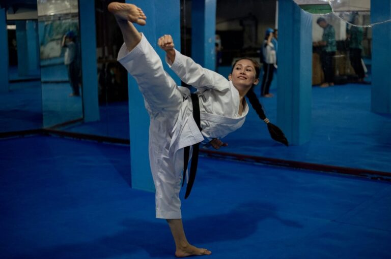 Afghan-born champion sustains hope for refugees stranded in Indonesia through karate