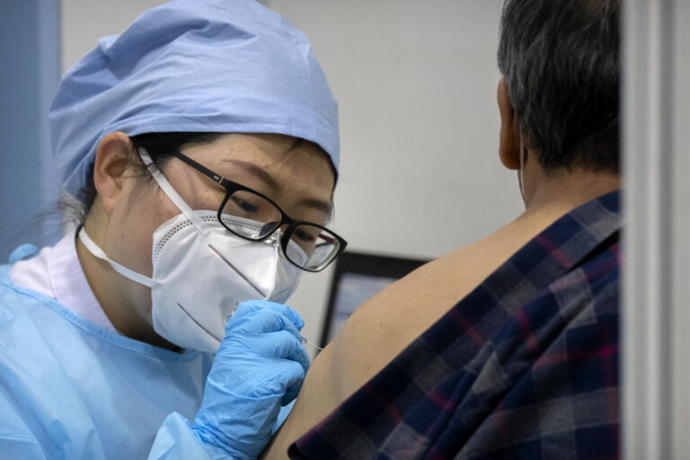 Beijing appears to retract COVID-19 vaccine mandate after pushback