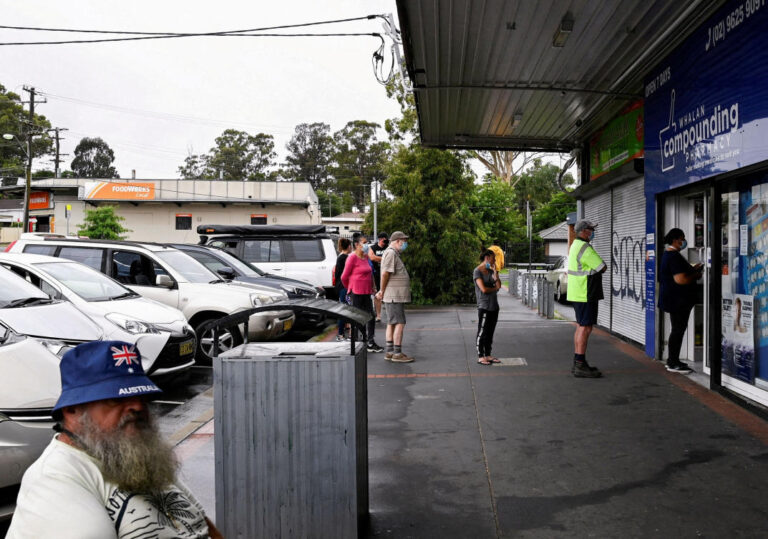 Record number of coronavirus-hit Australians in hospital as omicron surges