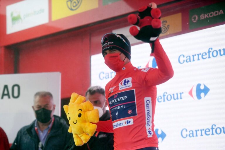 Rookie Evenepoel soars through fog into Vuelta lead