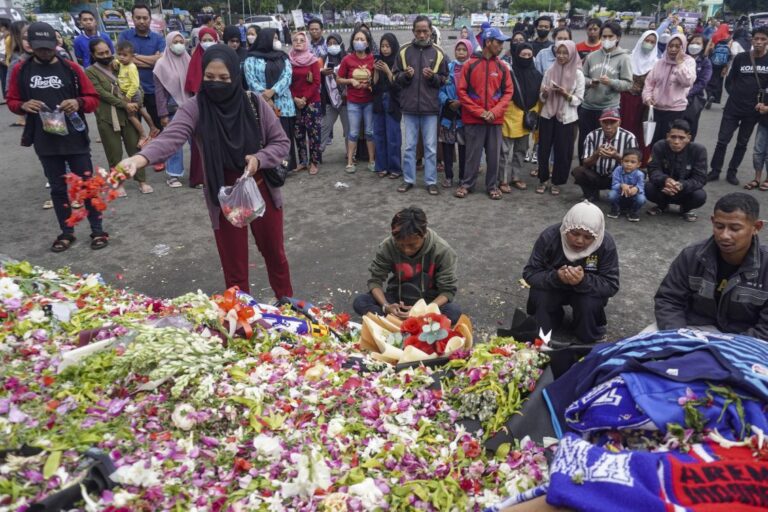 Fans mourn victims of Indonesian stadium stampede at Friday prayers