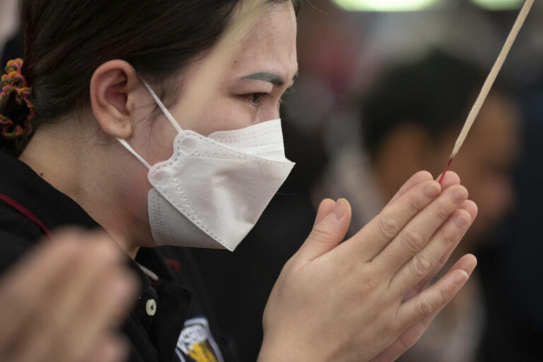 Mourners pray at Thai temple filled by children’s keepsakes