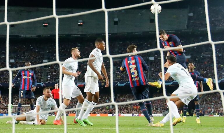 Robert Lewandowski keeps Barcelona barely alive in Champions League