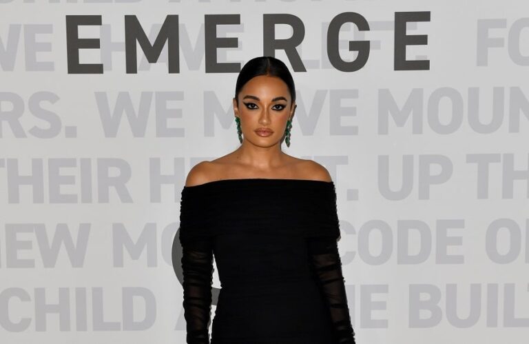 Jordanian Romanian designer Amina Muaddi spotted at Prada show in Milan