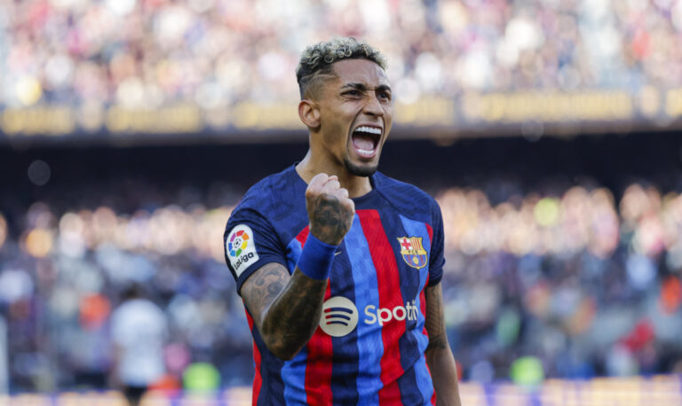 Raphinha header helps 10-man Barca to nervy Valencia win