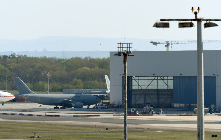 Several hurt after man drives into pedestrians at German airport garage