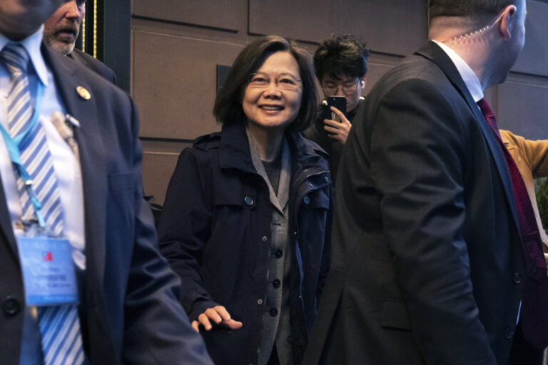 Taiwan president welcomed, denounced by Chinese community in New York as she arrives for a stopover